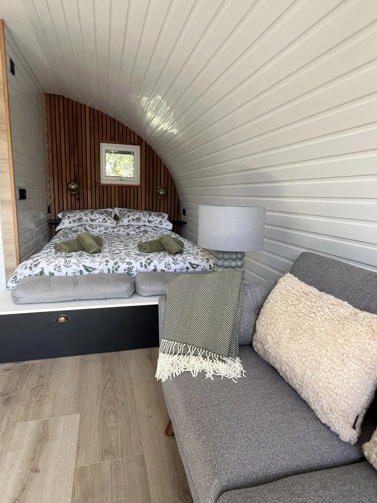 Sofa in the lounge with the bed beyond
